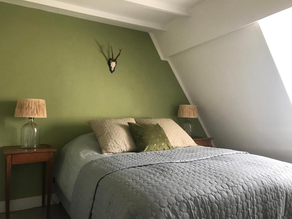 Llit o llits en una habitació de Rijksmonument het Telmerck Zutphen