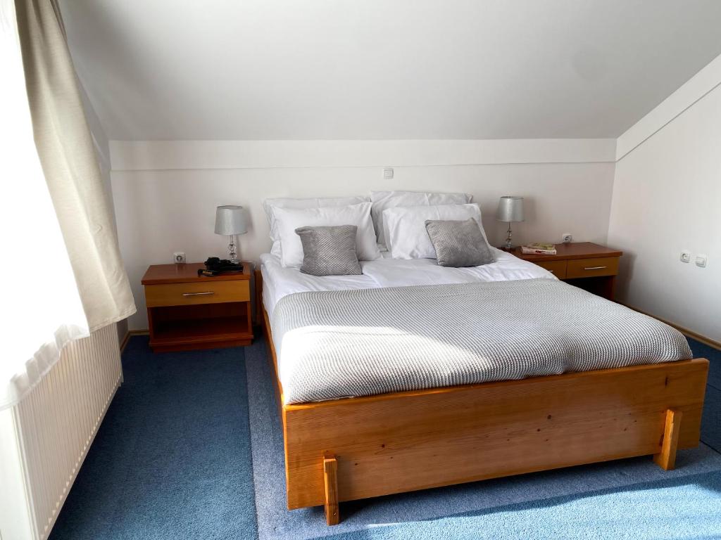 Postel nebo postele na pokoji v ubytování Fado Apartments Lendava