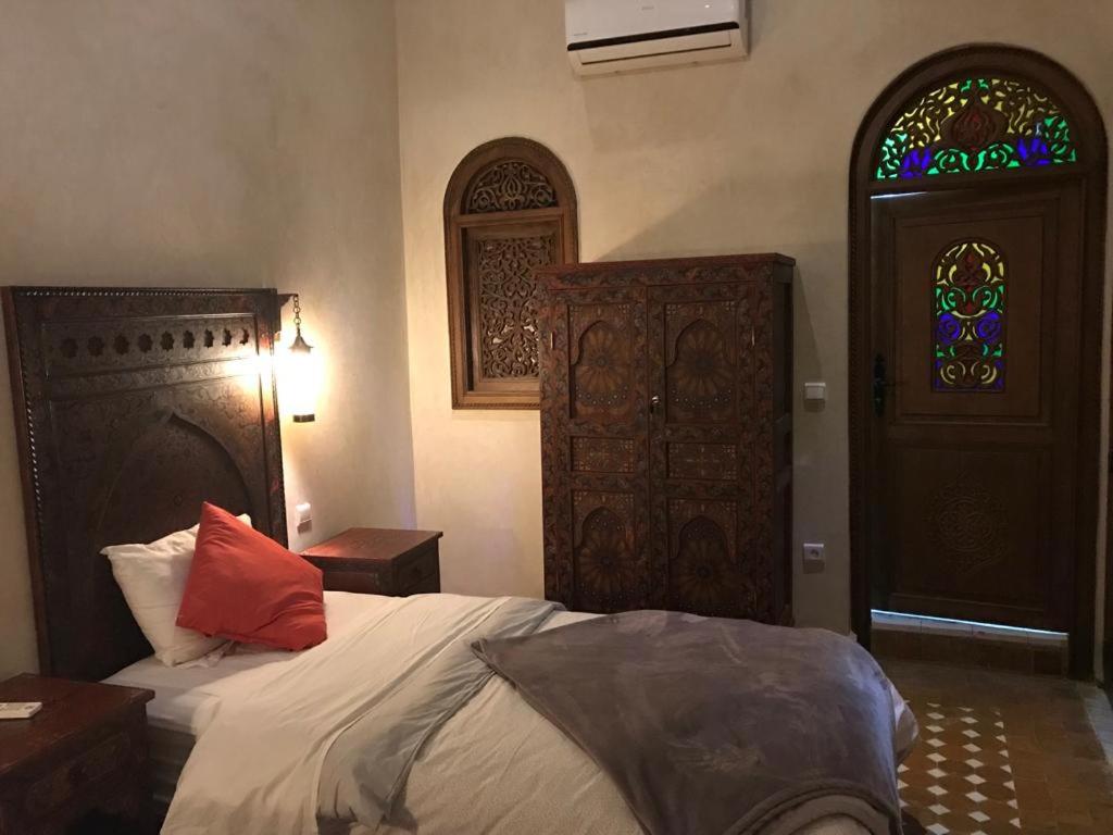 Postel nebo postele na pokoji v ubytování Riad le petit ksar