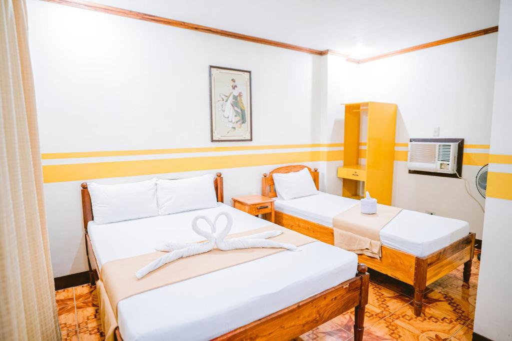 Postel nebo postele na pokoji v ubytování Jazmine's Place