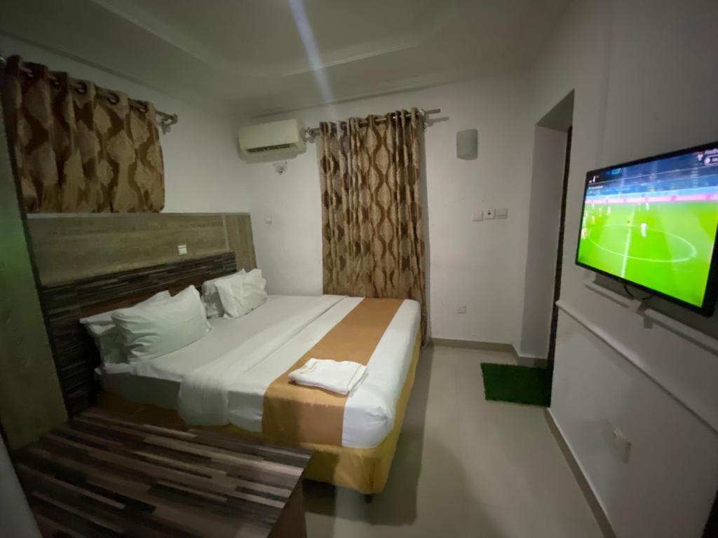 Postel nebo postele na pokoji v ubytování Palazzo Apartments