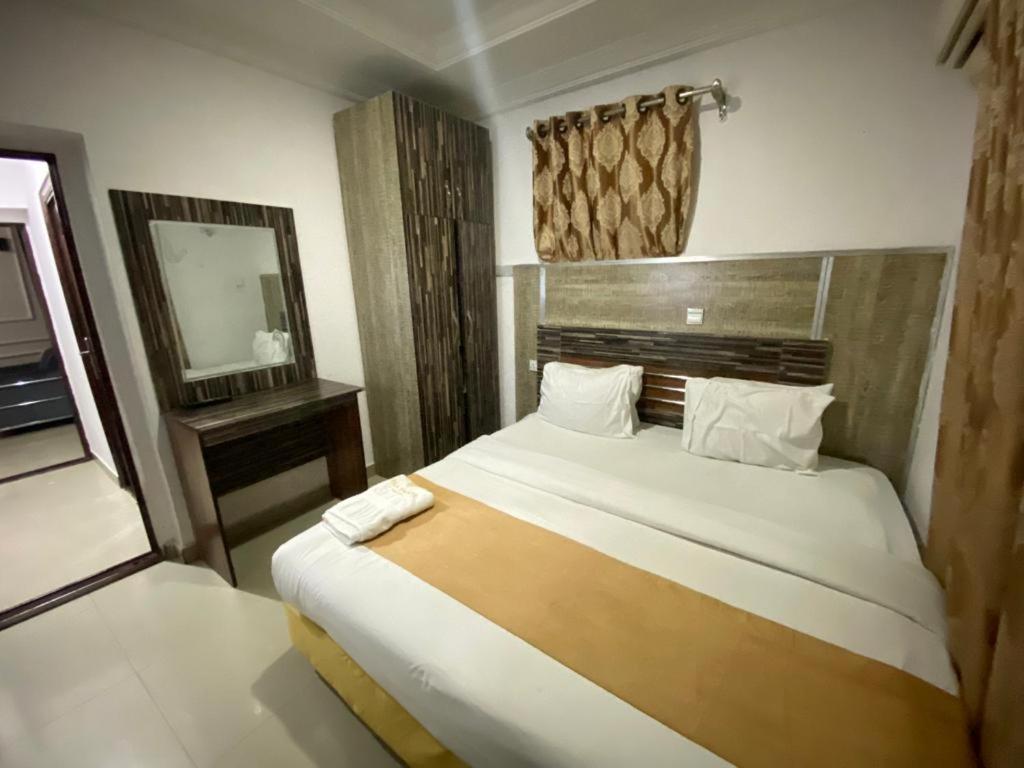 Postel nebo postele na pokoji v ubytování Palazzo Apartments