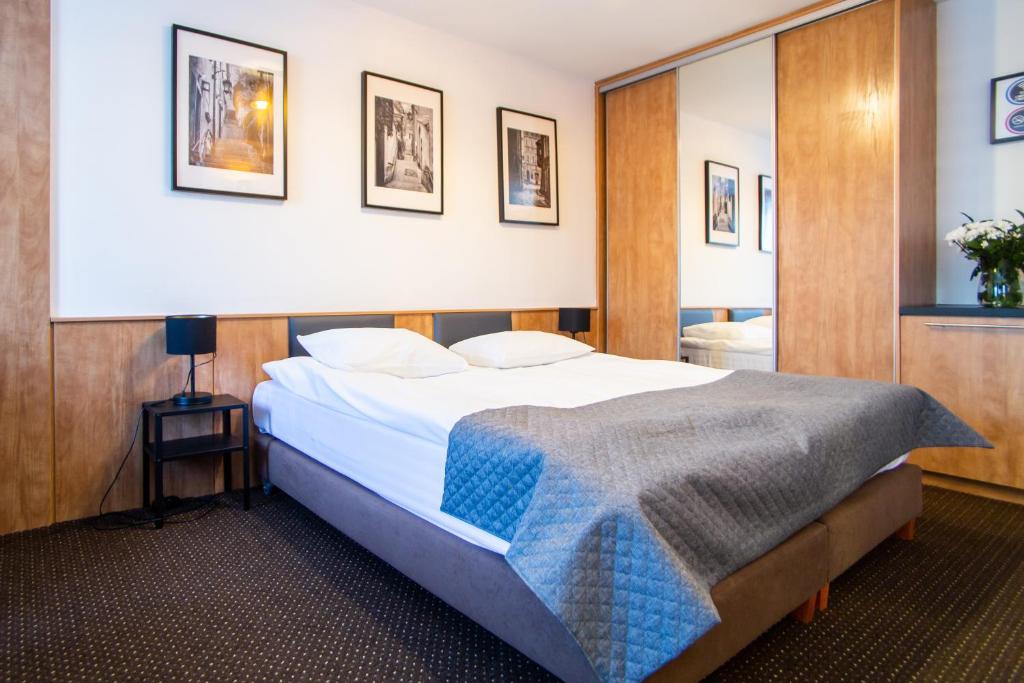 Posteľ alebo postele v izbe v ubytovaní Warsaw Apartments - Apartamenty Sadyba