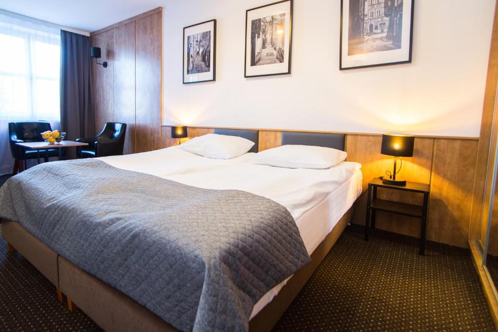 Posteľ alebo postele v izbe v ubytovaní Warsaw Apartments - Apartamenty Sadyba