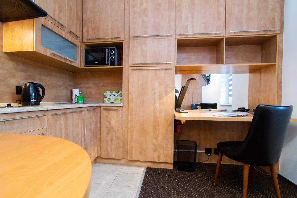Kuchyňa alebo kuchynka v ubytovaní Warsaw Apartments - Apartamenty Sadyba
