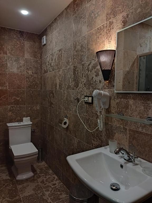 Koupelna v ubytování Hotel Cade
