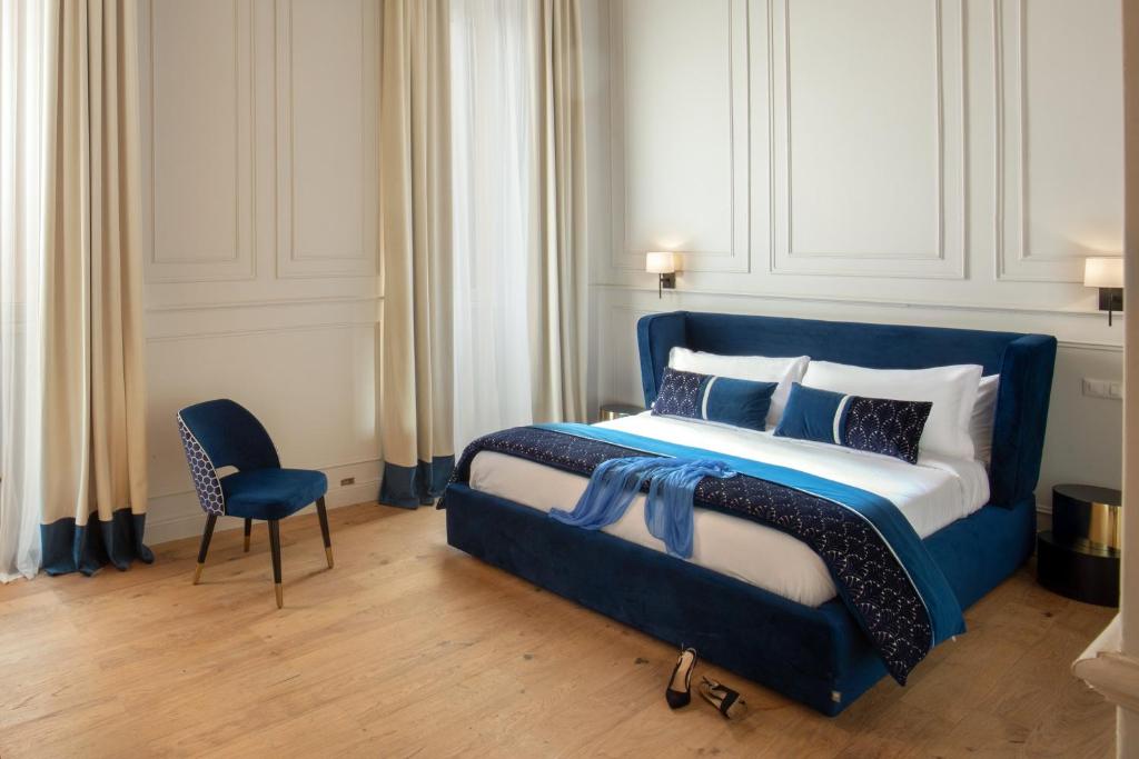 A bed or beds in a room at Garden Palace
