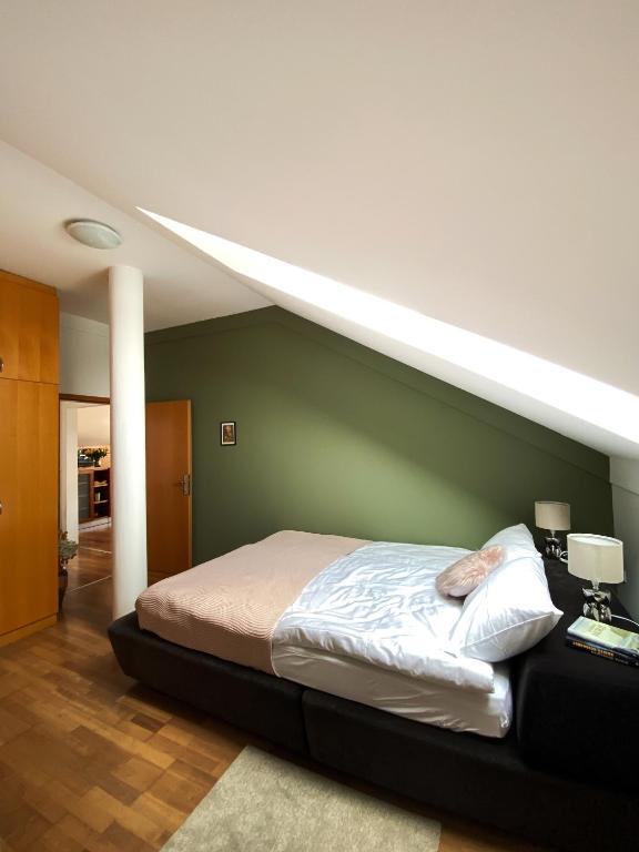 Postel nebo postele na pokoji v ubytování Fado Apartments Lendava