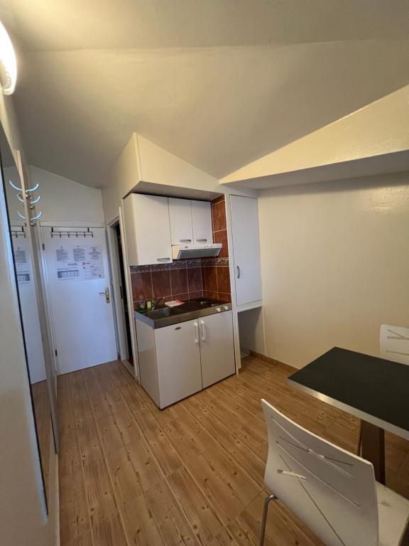 Kuchyň nebo kuchyňský kout v ubytování Apartments Villa Simoni