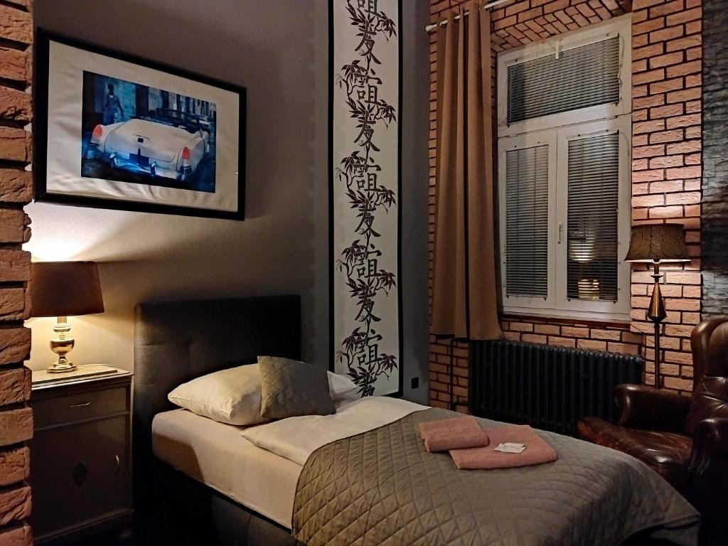 Postel nebo postele na pokoji v ubytování Hotel Cade