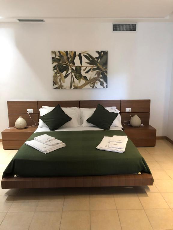 Postel nebo postele na pokoji v ubytování B&B Zia Nì