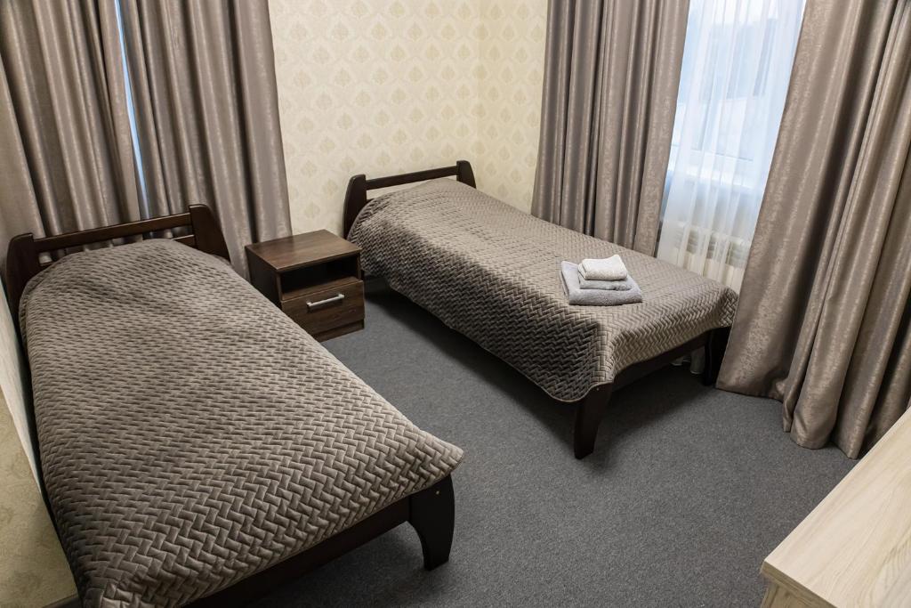 Postel nebo postele na pokoji v ubytování Готель Otelnov