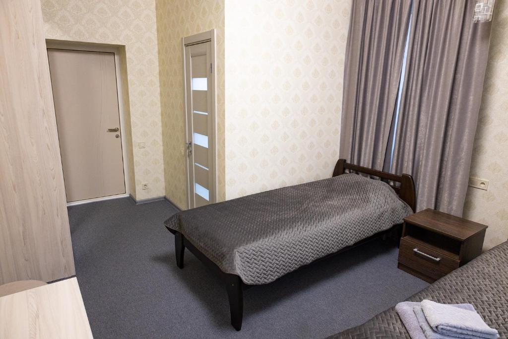 Postel nebo postele na pokoji v ubytování Готель Otelnov