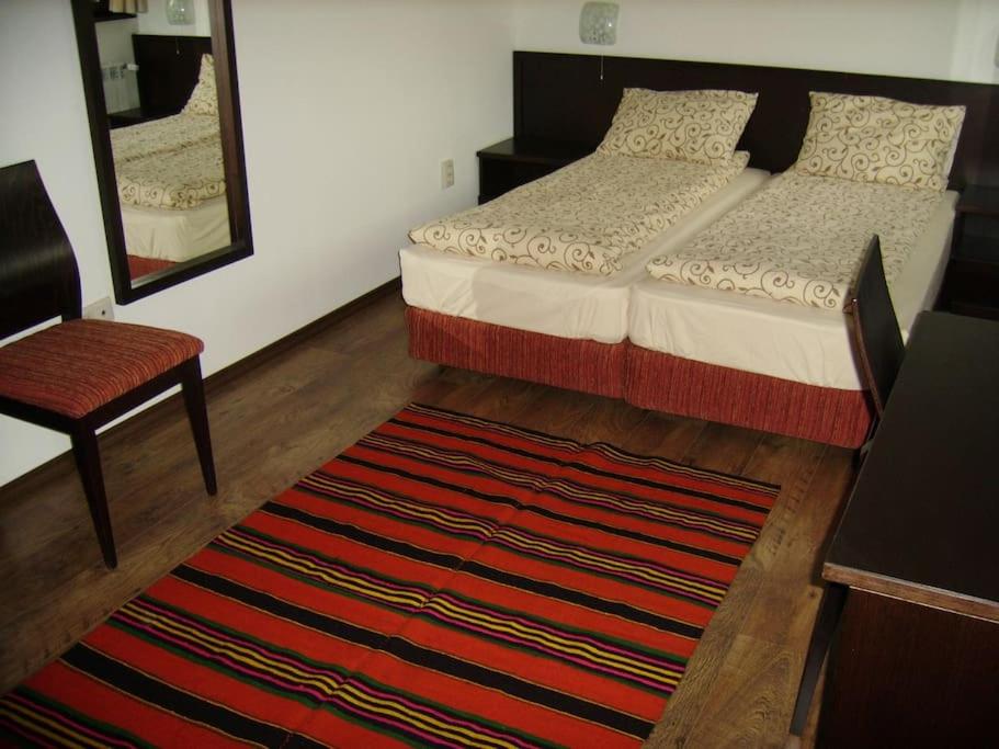 A bed or beds in a room at House Trivia