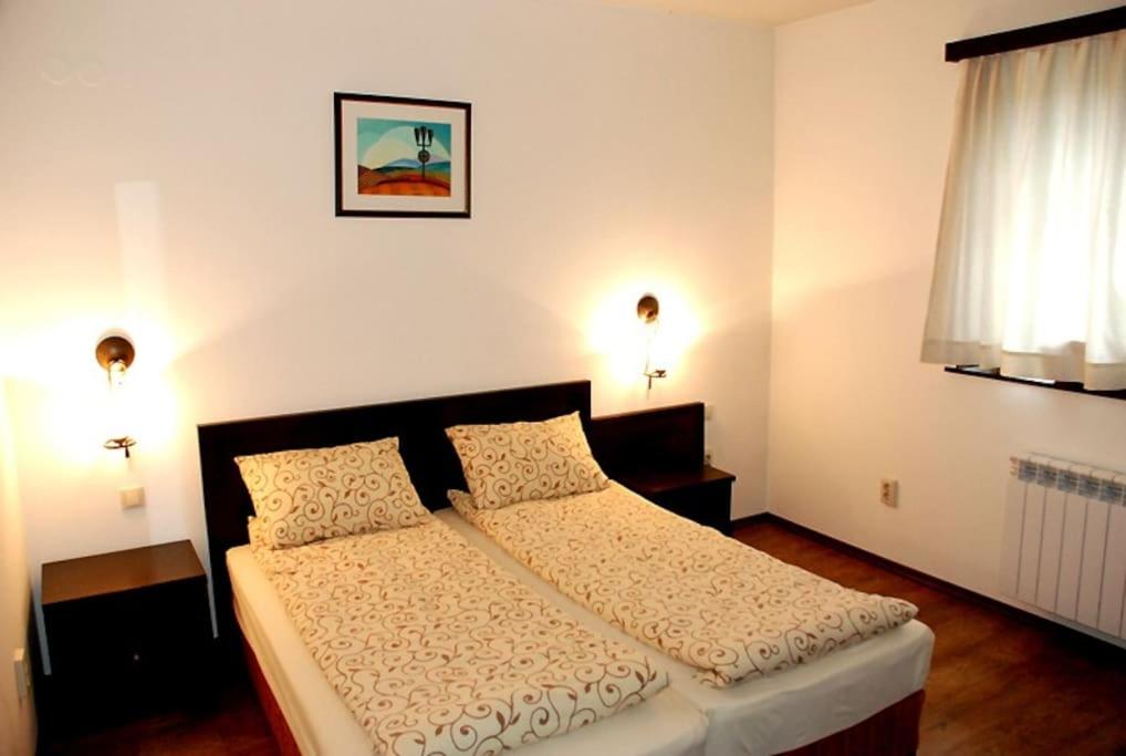 A bed or beds in a room at House Trivia