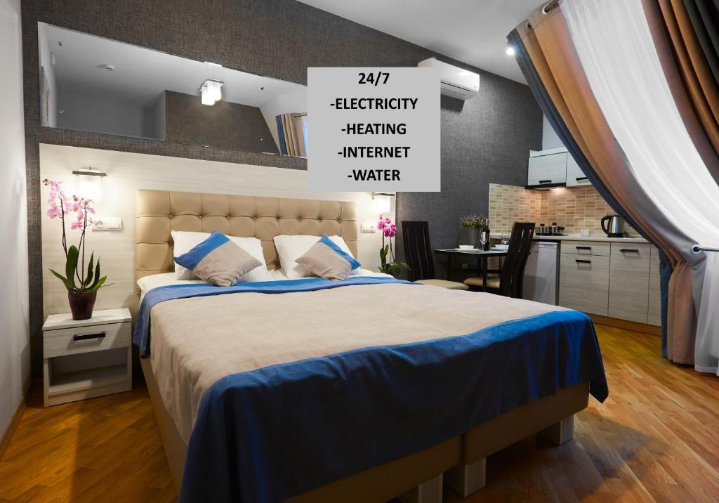 Postel nebo postele na pokoji v ubytování ANTARES Apart hotel