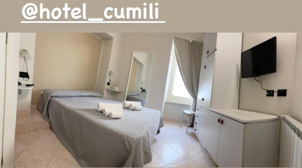 Postel nebo postele na pokoji v ubytování Hotel Cumilì