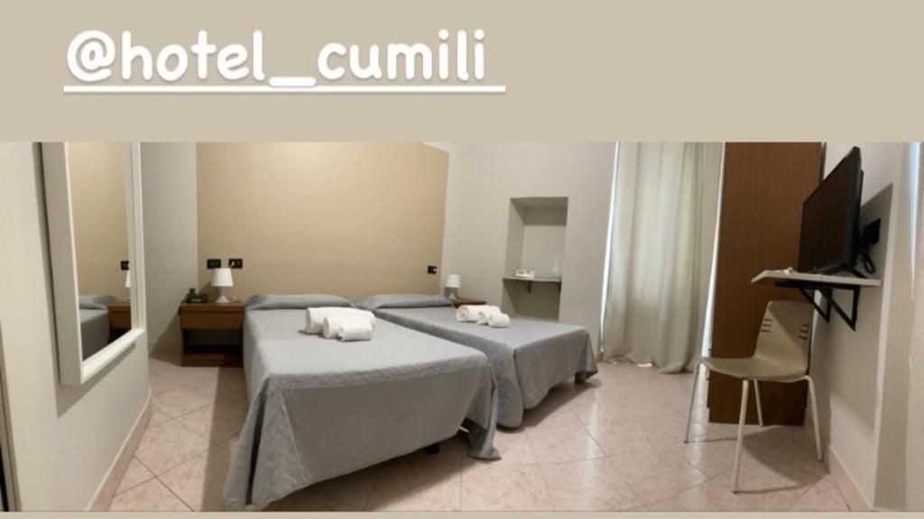 Postel nebo postele na pokoji v ubytování Hotel Cumilì