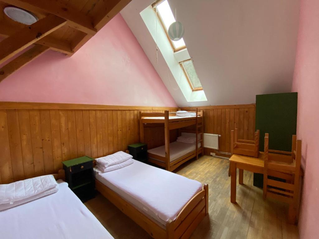 Postel nebo postele na pokoji v ubytování Středisko ekologické výchovy SEVER