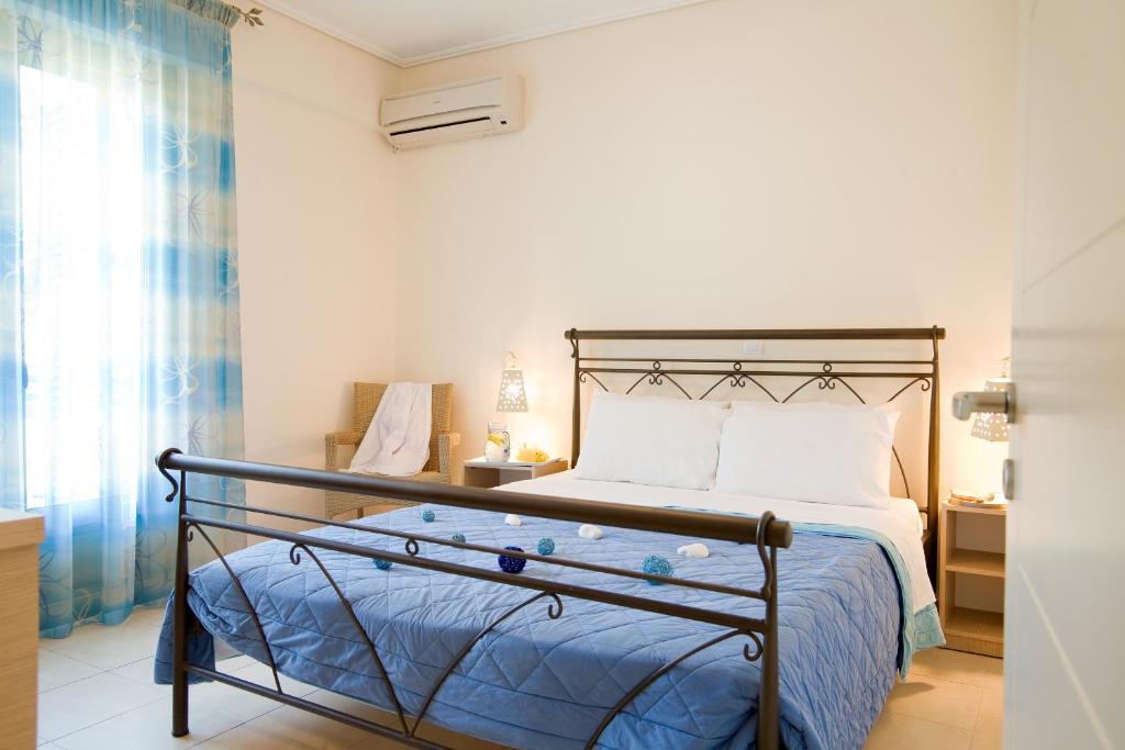 Postel nebo postele na pokoji v ubytování Anemolia Apartments