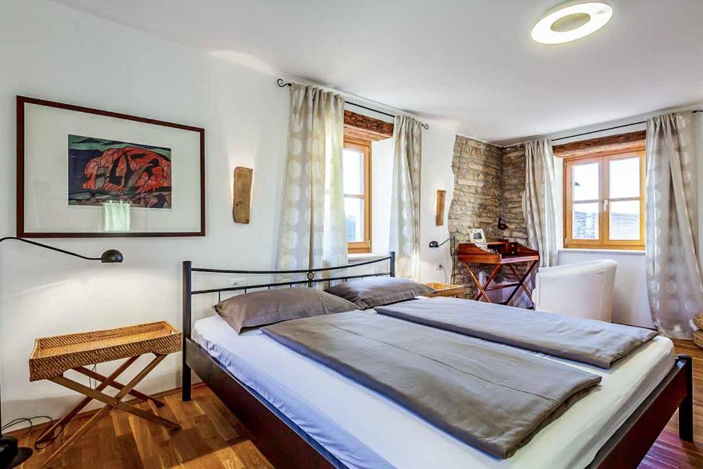 Łóżko lub łóżka w pokoju w obiekcie Villa Perla Sisan