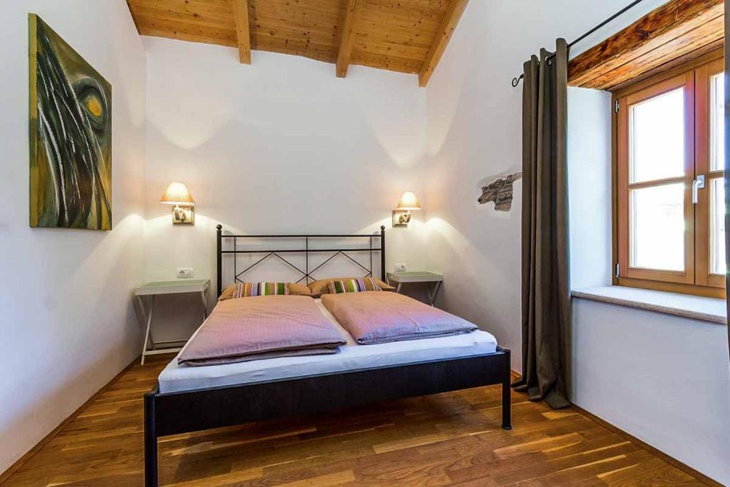 Łóżko lub łóżka w pokoju w obiekcie Villa Perla Sisan
