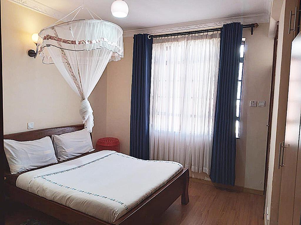 Letto o letti in una camera di MANI HOMES