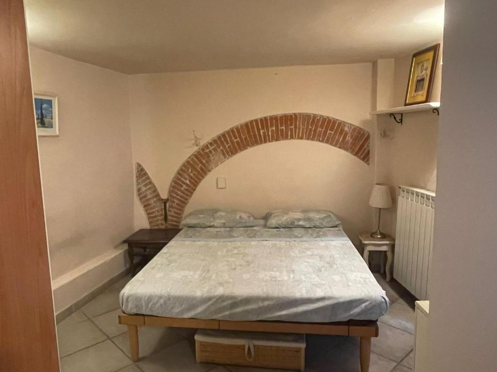 Posteľ alebo postele v izbe v ubytovaní Incantevole Monolocale a Lucca nel Centro Storico - EstateGuard Group