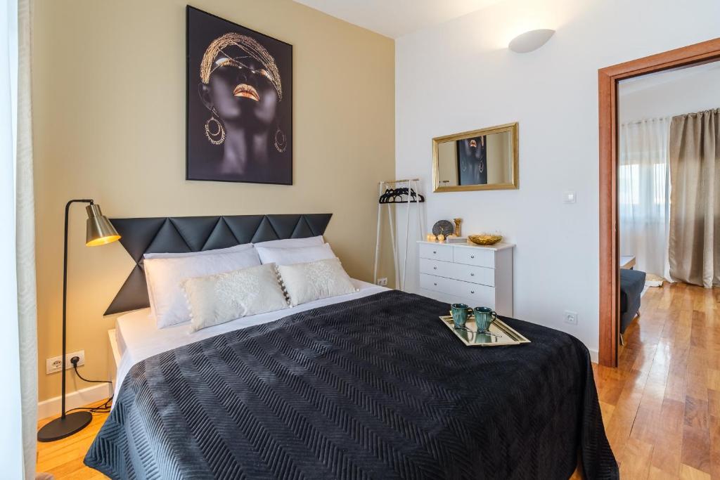Postel nebo postele na pokoji v ubytování Apartments Tomy