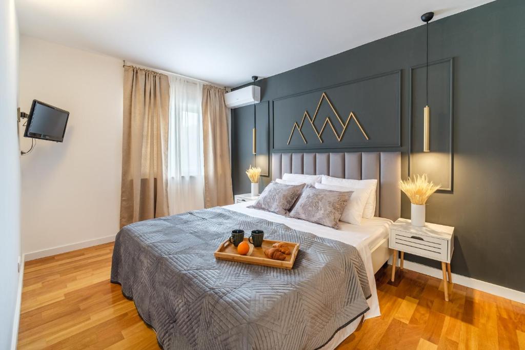 Postel nebo postele na pokoji v ubytování Apartments Tomy
