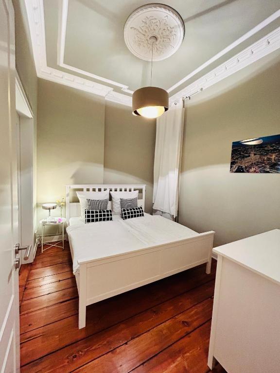 Postel nebo postele na pokoji v ubytování Blue City Apartment’s