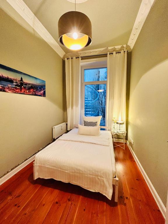 Postel nebo postele na pokoji v ubytování Blue City Apartment’s