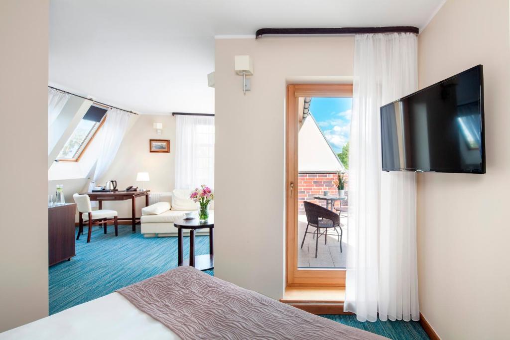TV a/nebo společenská místnost v ubytování Hotel Bonum Old Town