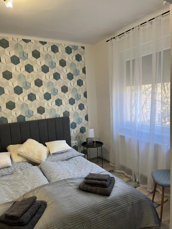 Postel nebo postele na pokoji v ubytování Móriczka Apartman