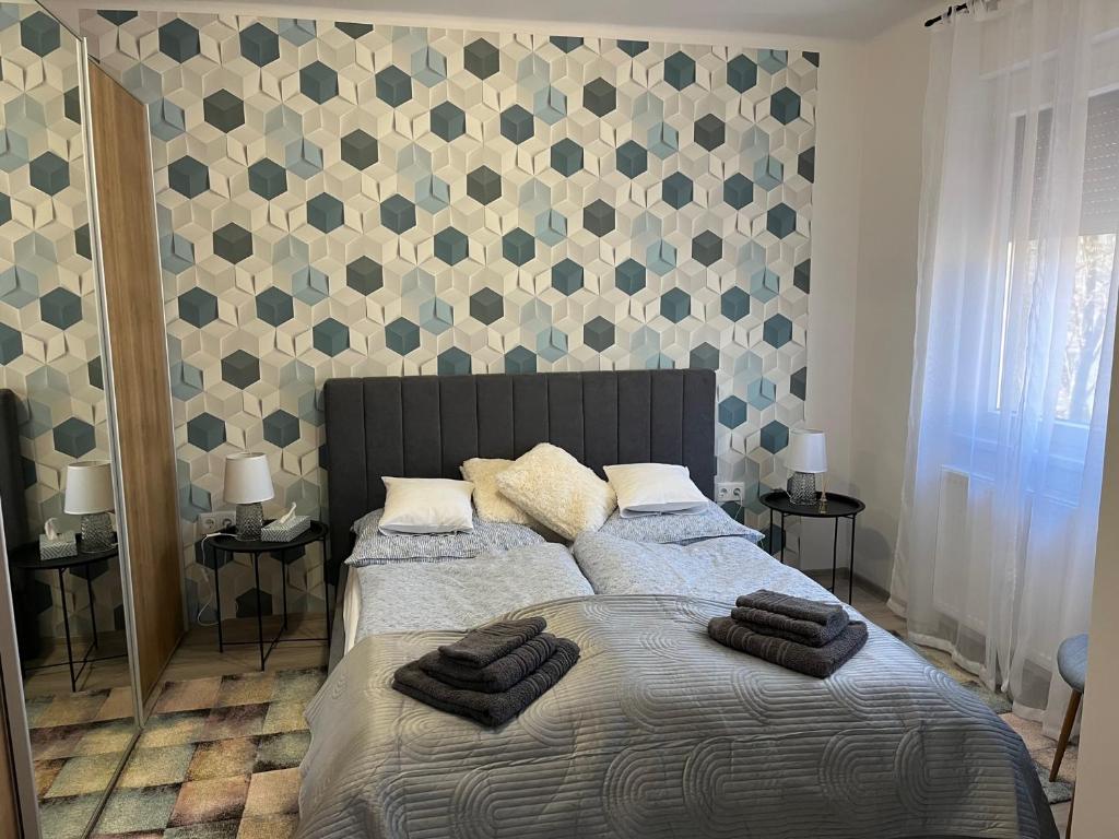Postel nebo postele na pokoji v ubytování Móriczka Apartman