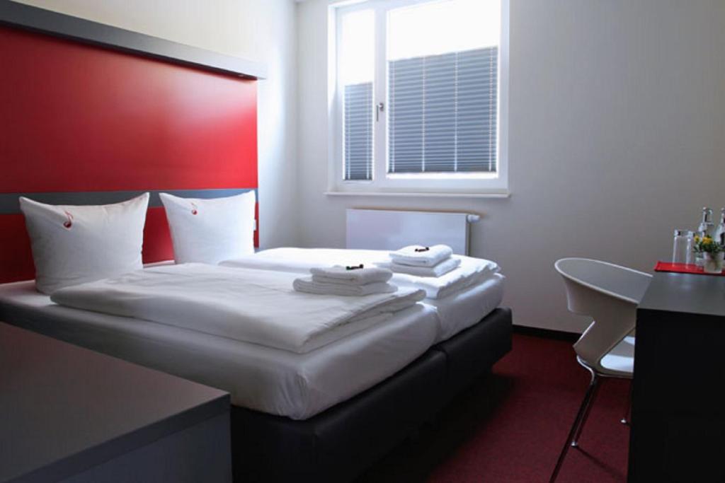 Postel nebo postele na pokoji v ubytování Hotel VielHarmonie