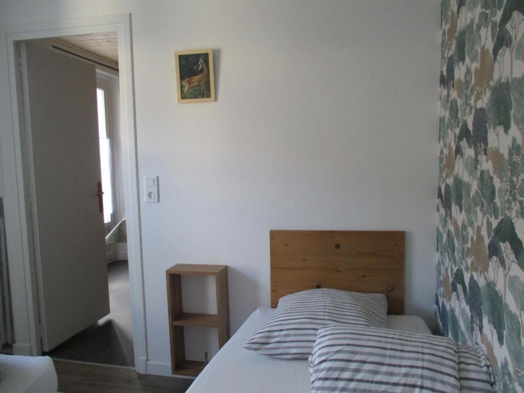 Posteľ alebo postele v izbe v ubytovaní Gîte les Bois