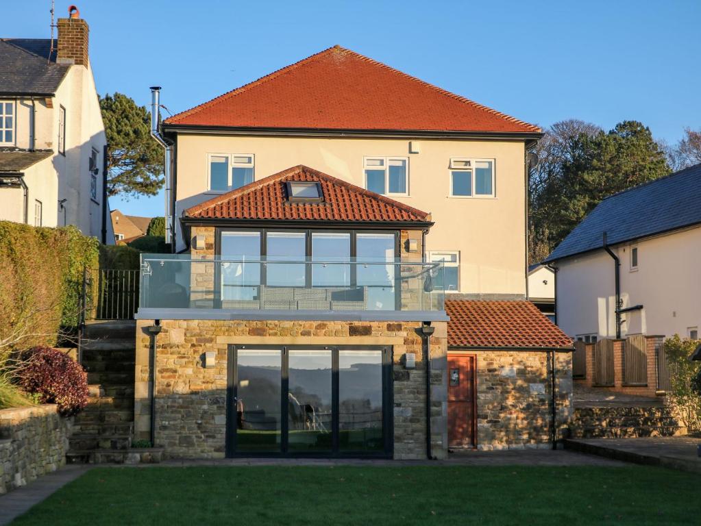 a house with a glass extension to it at Glenhurst in Dronfield