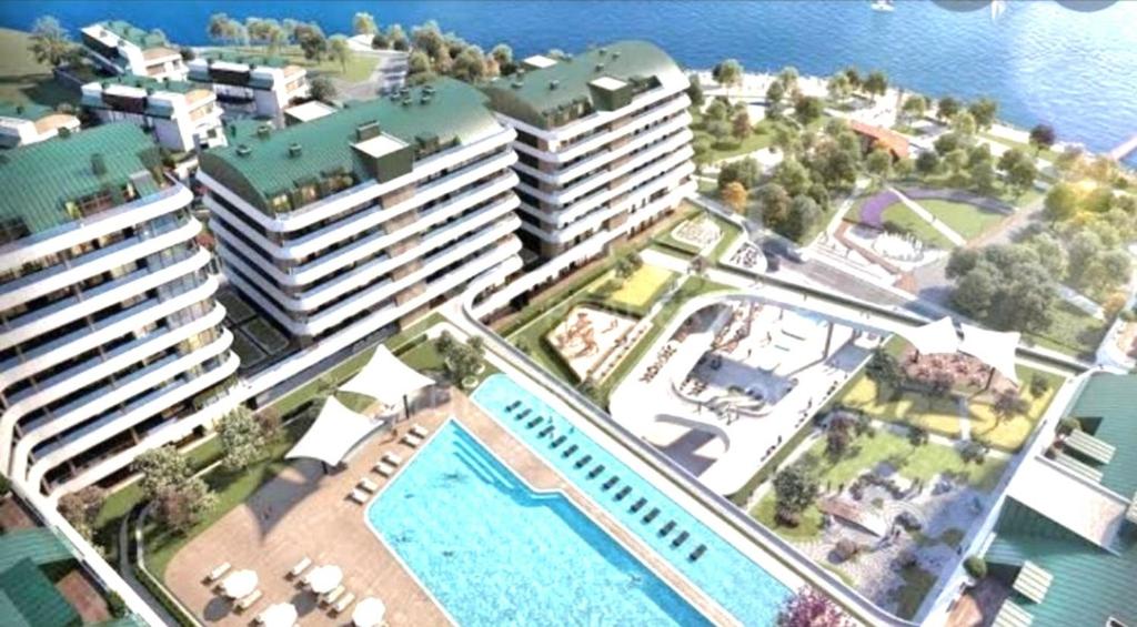 a model of a resort with a pool and buildings at Amazing Seafront new 4 Bedrooms flat with free Wi-Fi in Buyukcekmece