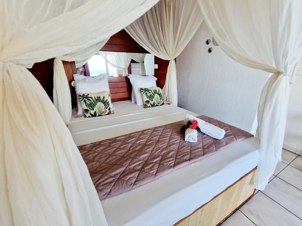 Postel nebo postele na pokoji v ubytování Hotel Le Manguier
