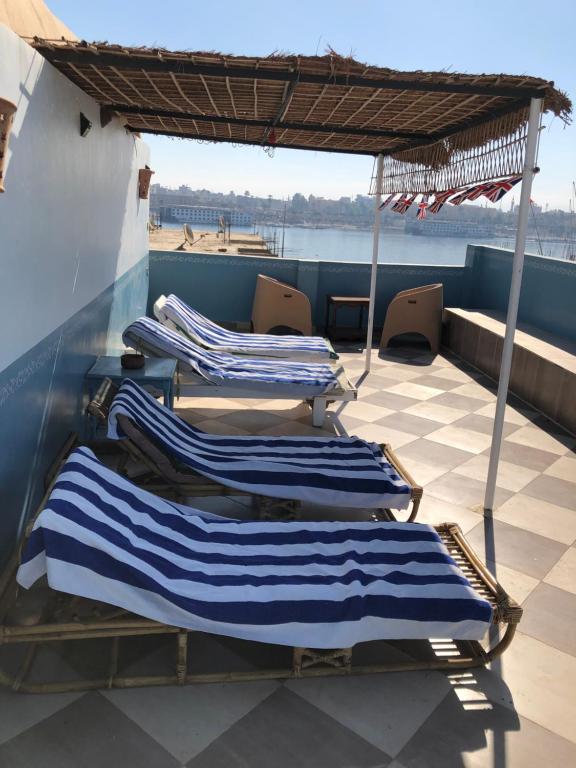 a group of blue and white towels on a boat at The Brown House in Luxor