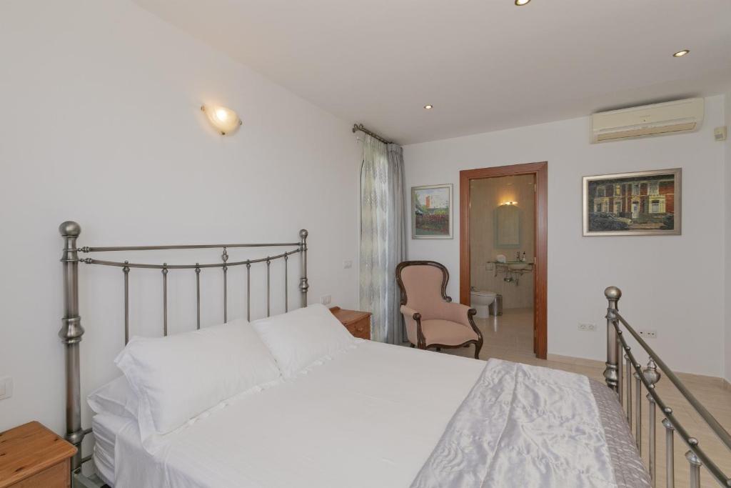 Postel nebo postele na pokoji v ubytování Villa Panoramica
