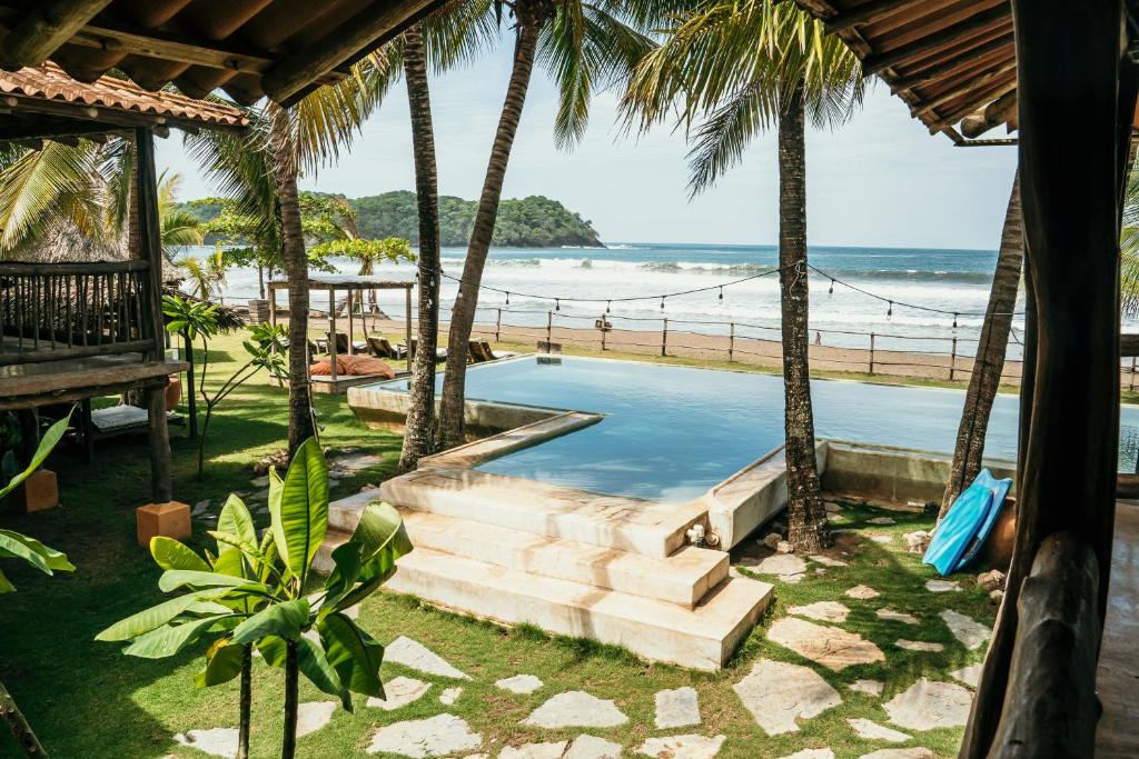 a view of the beach from a resort with a swimming pool at El Sitio de Playa Venao in Playa Venao