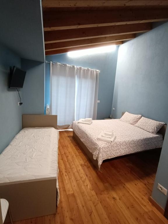 Postel nebo postele na pokoji v ubytování CONSTANCIA TRATTORIA