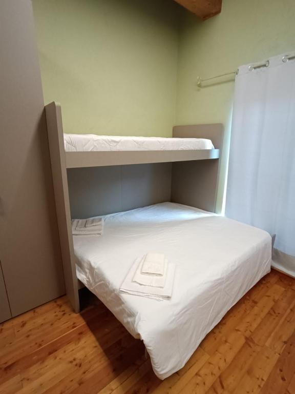 Postel nebo postele na pokoji v ubytování CONSTANCIA TRATTORIA