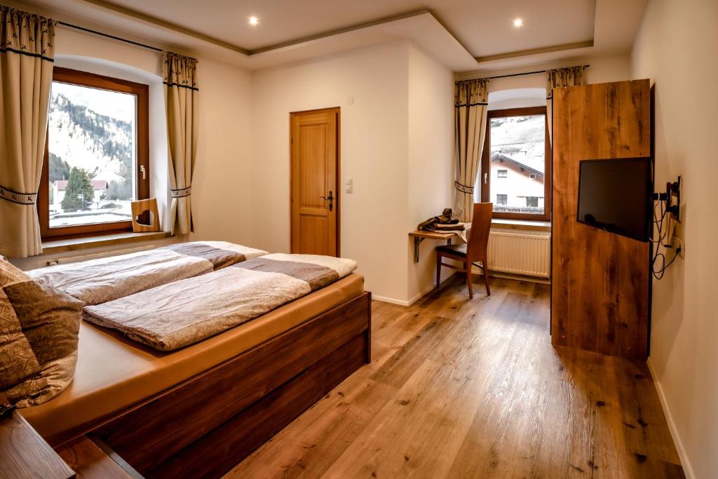 Postel nebo postele na pokoji v ubytování Gasthof Geraerhof
