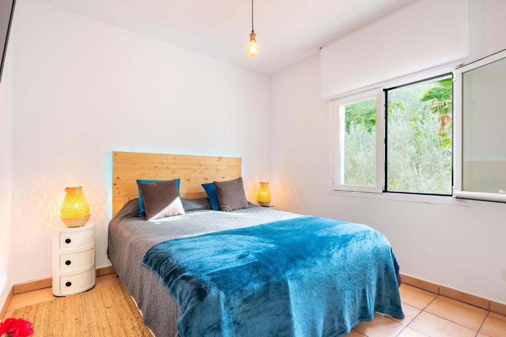 Postel nebo postele na pokoji v ubytování Villa Blanca Santa Eulalia