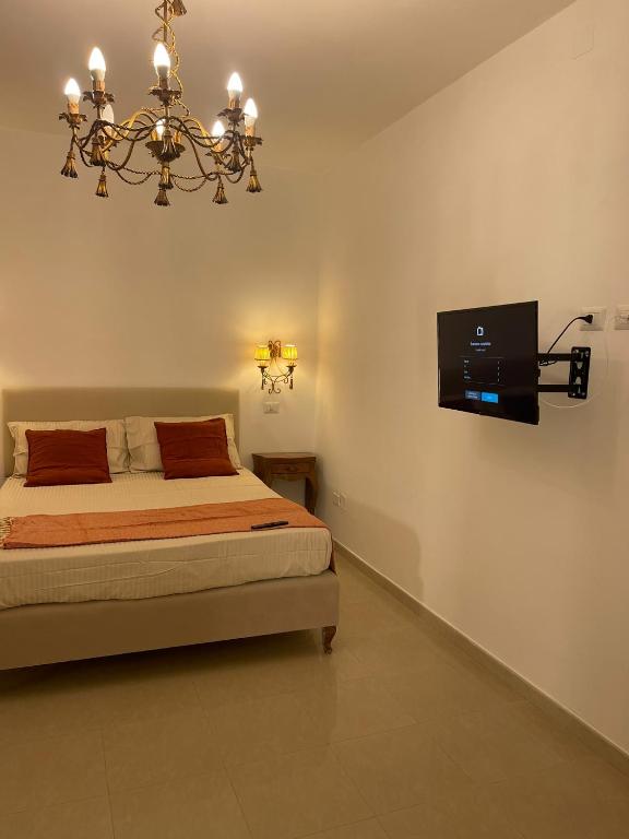 Ένα ή περισσότερα κρεβάτια σε δωμάτιο στο PALAZZO MAZZINI 1