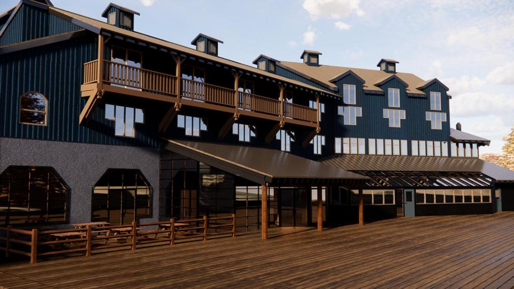 a large black building with a wooden deck at The Approach Hotel in Panorama