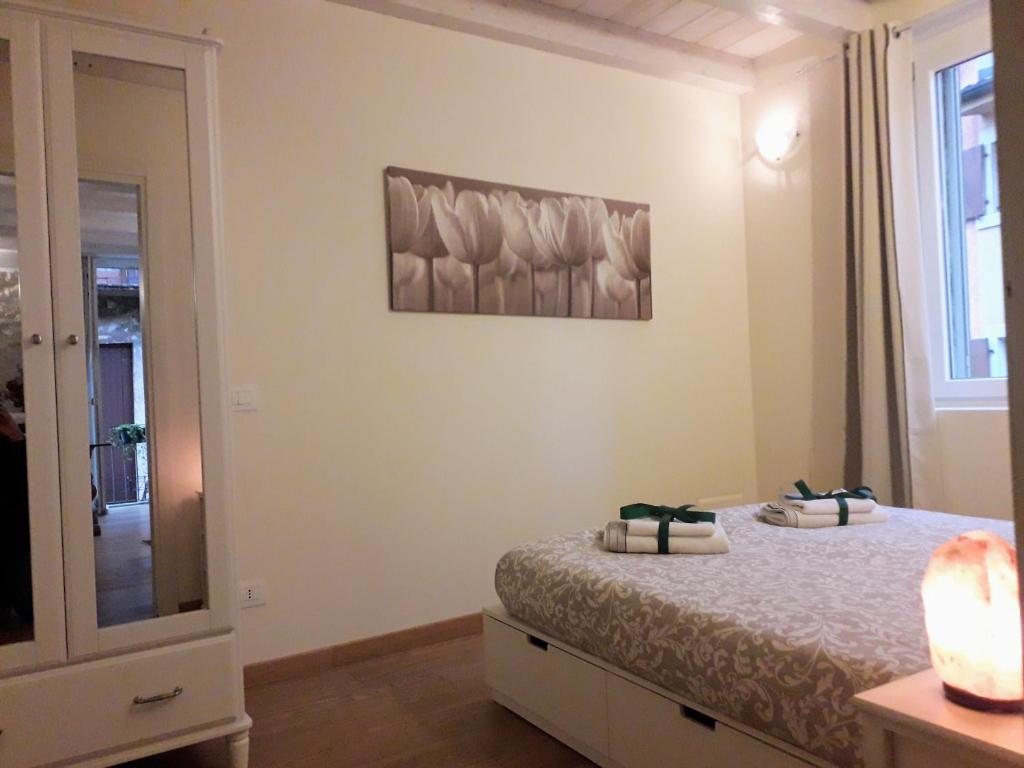 Łóżko lub łóżka w pokoju w obiekcie Casa Angie